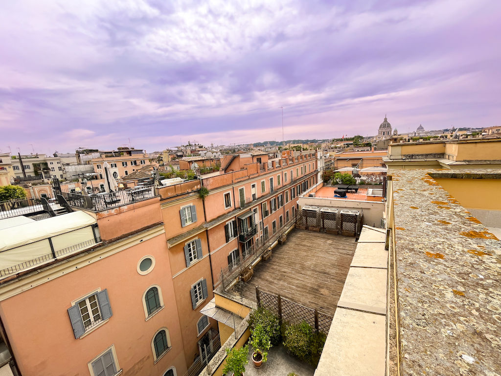 A view of Rome's rooftops and St. Peter's Basilica from one of Temple Rome's terraces. 