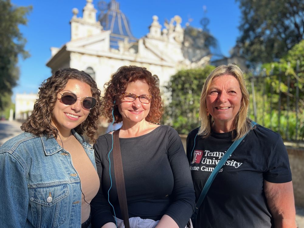 Three adult study abroad participants in front of church in Italy