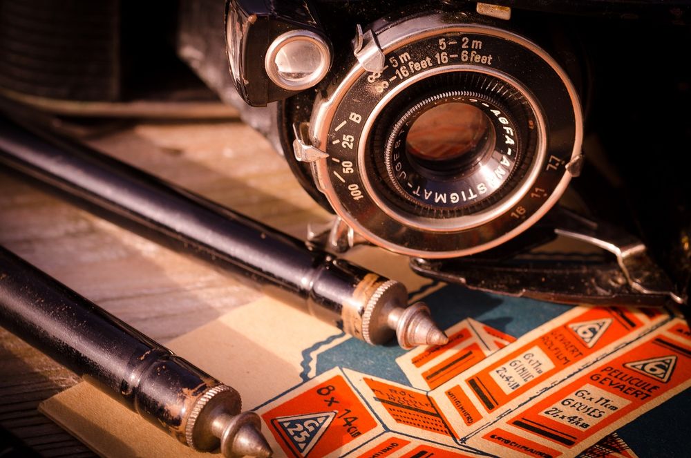Camera and other film materials on a table